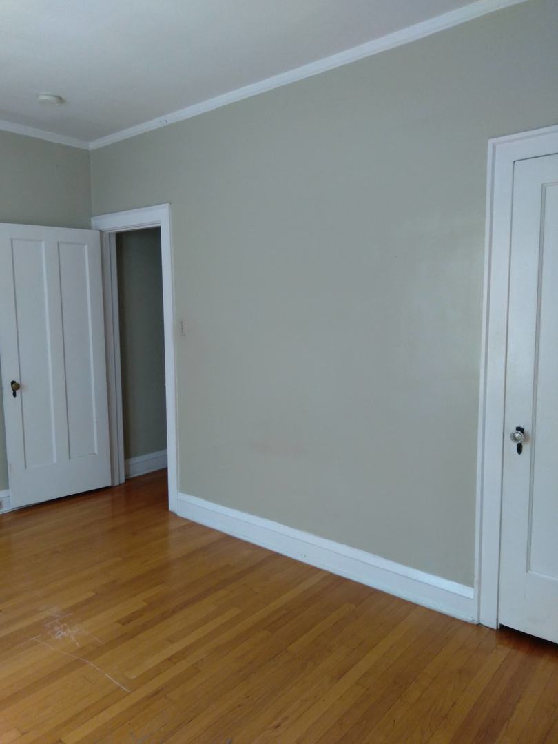 803 Case Street, Unit 3 Evanston, IL 60202 - Photo 3 of 12 a view of an empty room with wooden floor