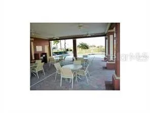 a view of a dining room with furniture and window