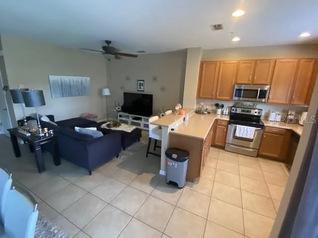 a kitchen with a sink appliances and cabinets