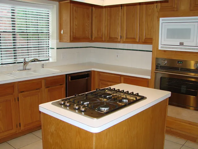a kitchen with a stove and a sink