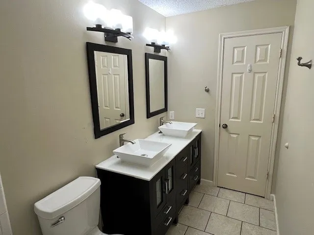 a bathroom with a sink vanity and a mirror