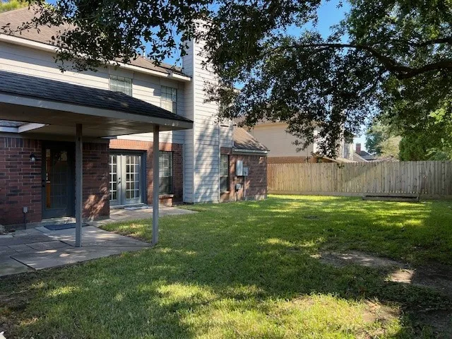 a view of a back yard of the house