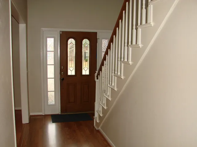 a view of entryway with wooden floor