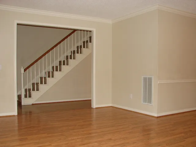 a view of an entryway with wooden floor