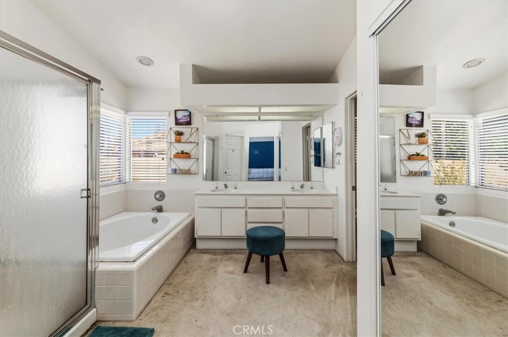 352 Leafwood Court Riverside, CA 92506 - Photo 30 of 42 a bathroom with a tub a sink and a large window