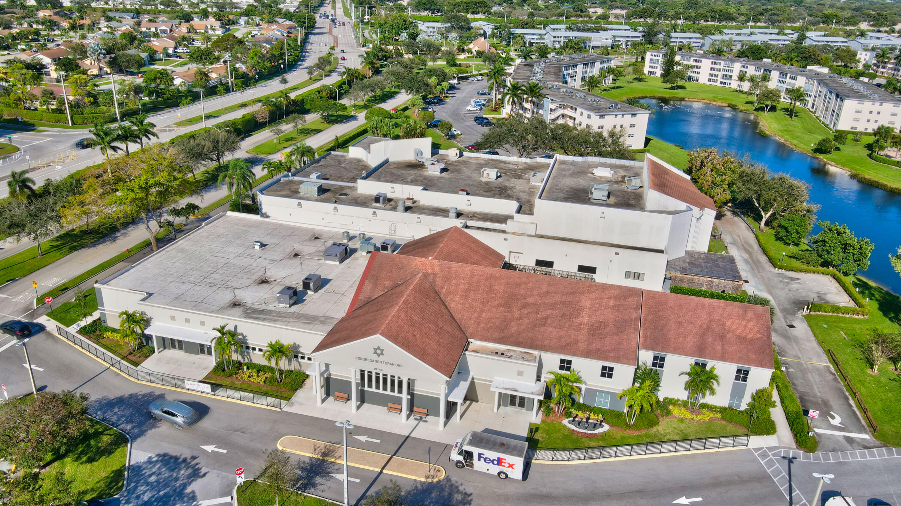 2069 Yarmouth C, Unit 2069 Boca Raton, FL 33434 - Photo 32 of 33 an aerial view of residential houses with outdoor space and parking