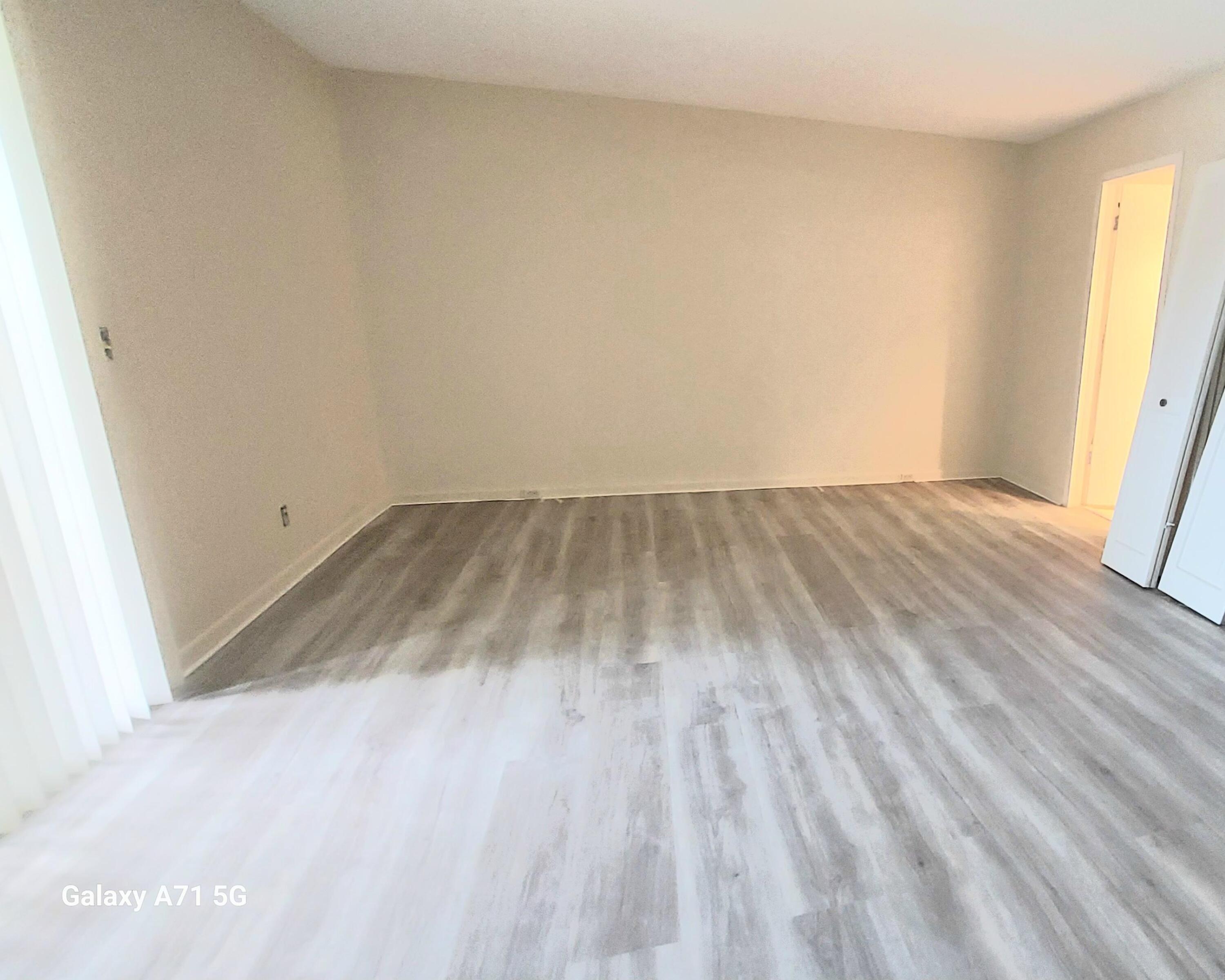 2069 Yarmouth C, Unit 2069 Boca Raton, FL 33434 - Photo 7 of 33 a view of wooden floor in a room
