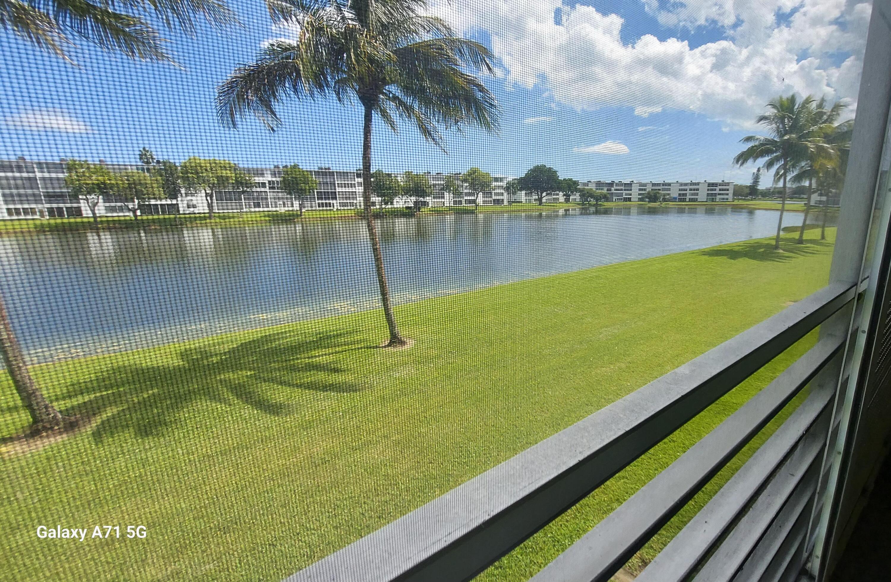 2069 Yarmouth C, Unit 2069 Boca Raton, FL 33434 - Photo 10 of 33 a view of a lake with outdoor space