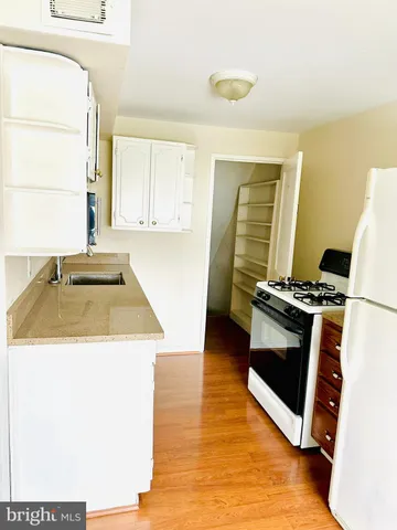 a view of a kitchen from the hallway