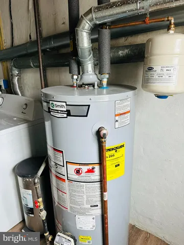 a view of a room with wooden floor and a window