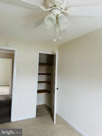 a bathroom with a bath tub with a shower