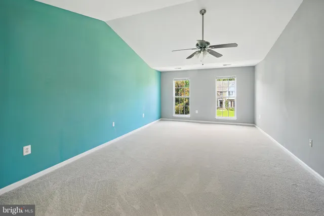 a view of an entryway with wooden floor and door