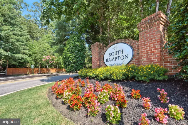 a front view of a multi story building with a sign board