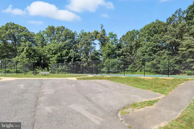 a view of a swimming pool with an outdoor space and seating area