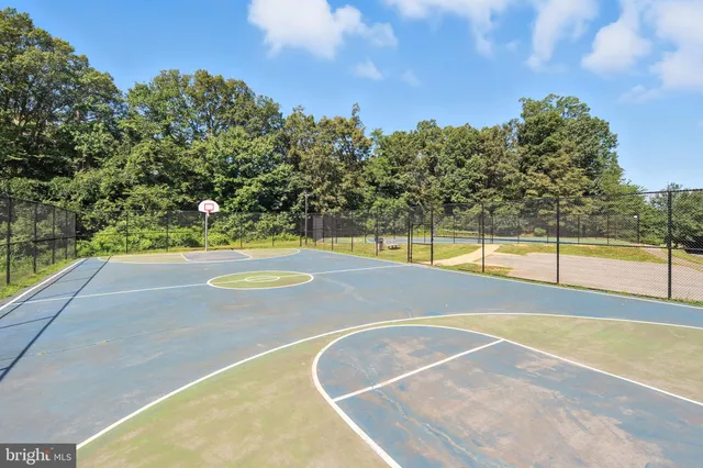 a view of a swimming pool and a yard