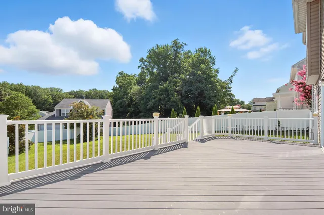 a view of balcony with deck and wooden floor