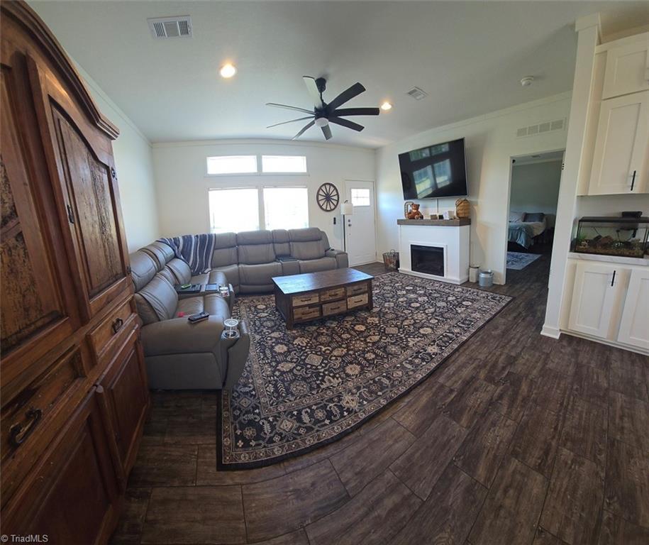 1266 Quaker Church Road Siloam, NC 27047 - Photo 4 of 29 Living room has electric fireplace