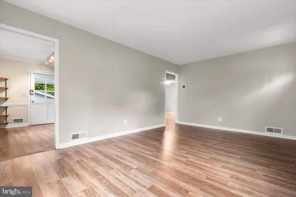 a kitchen with stainless steel appliances granite countertop a stove and a microwave