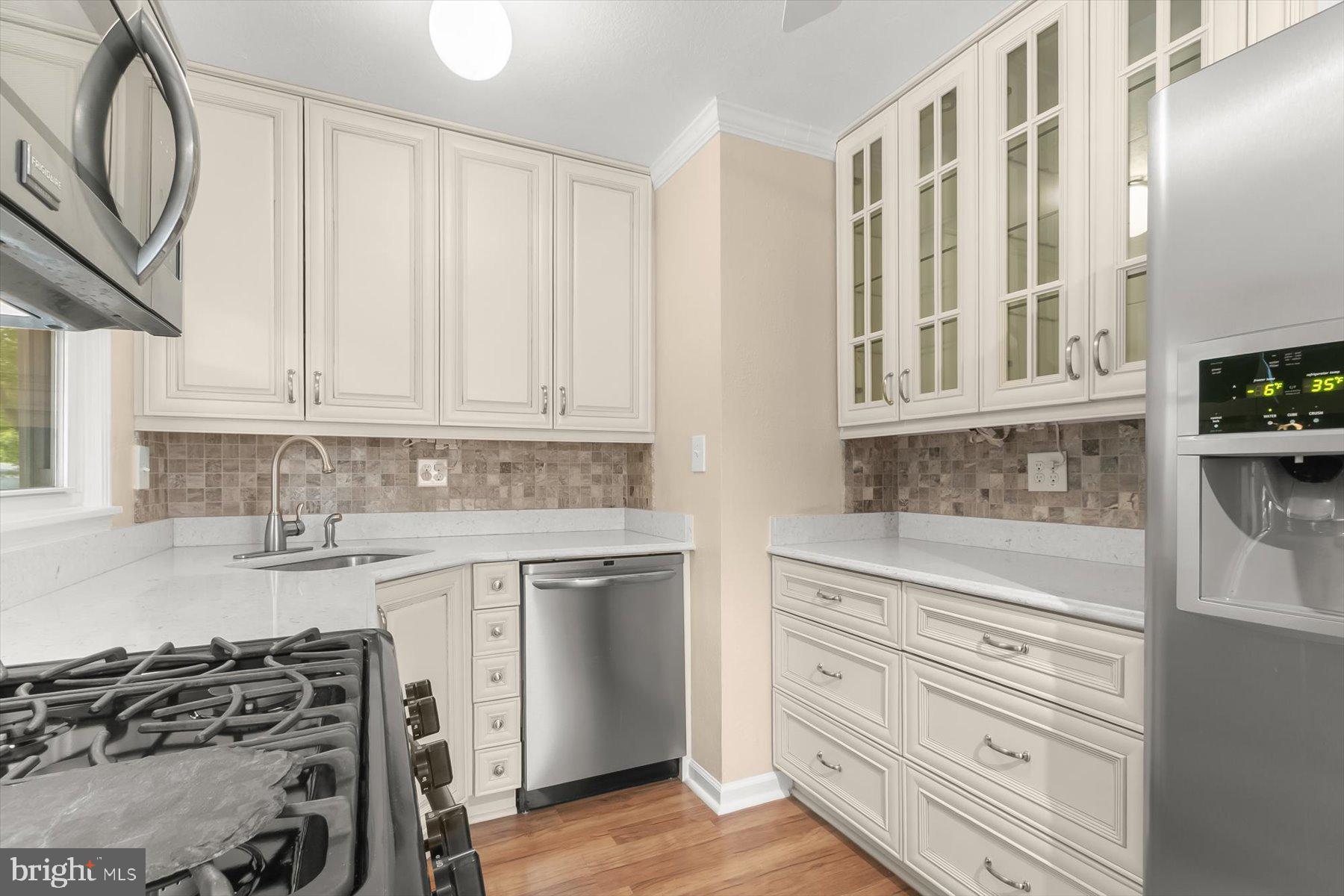 3105 Fayette Road Kensington, MD 20895 - Photo 16 of 93 a kitchen with stainless steel appliances granite countertop a stove and a white cabinets
