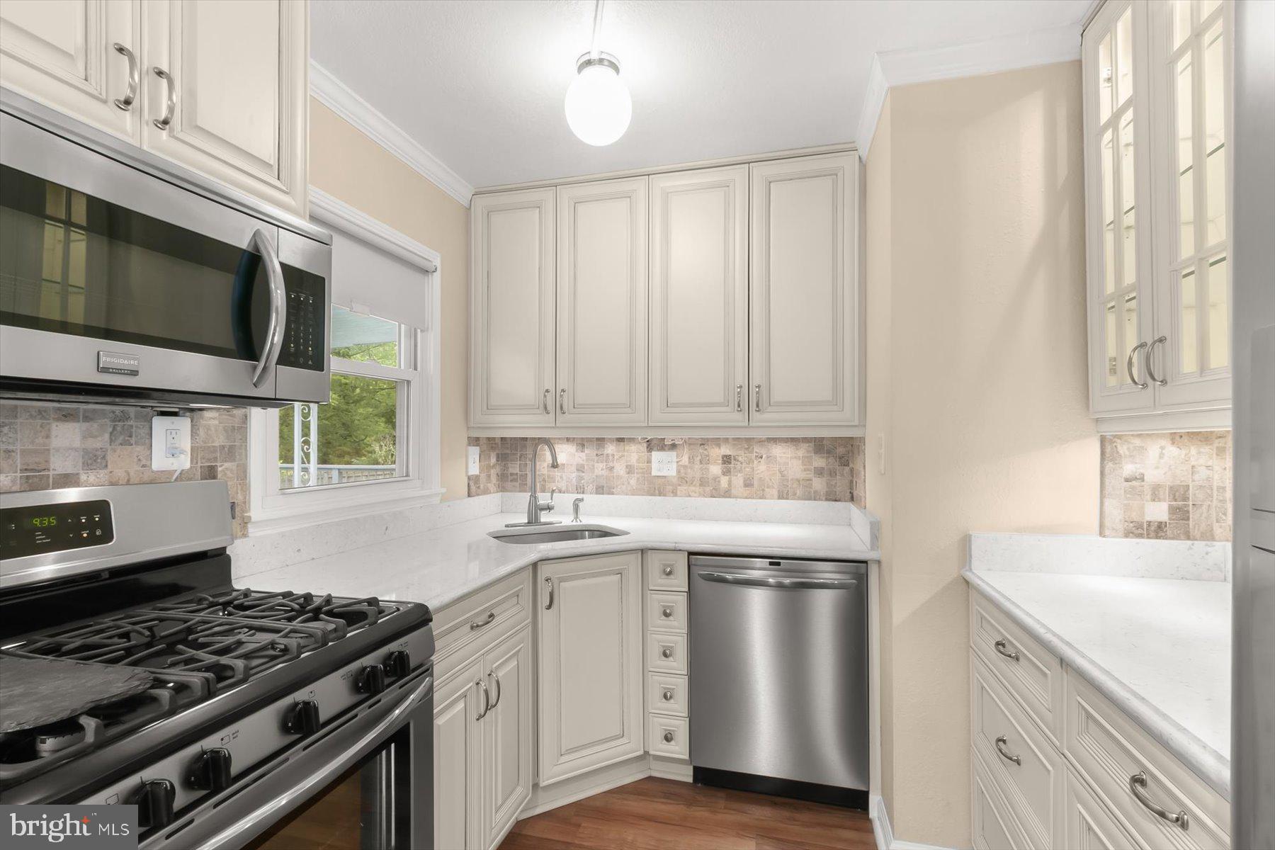 3105 Fayette Road Kensington, MD 20895 - Photo 19 of 93 a kitchen with stainless steel appliances a sink stove and cabinets