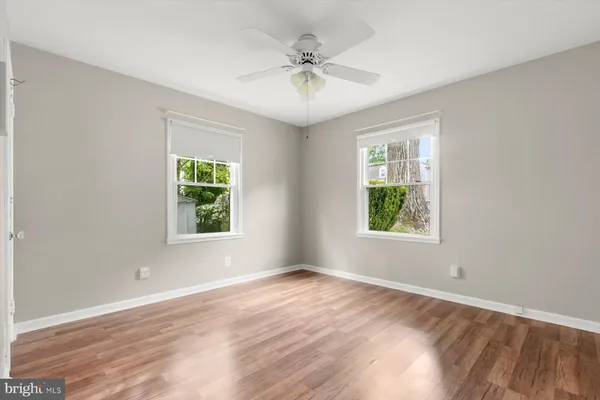 a view of staircase with white walls and a window