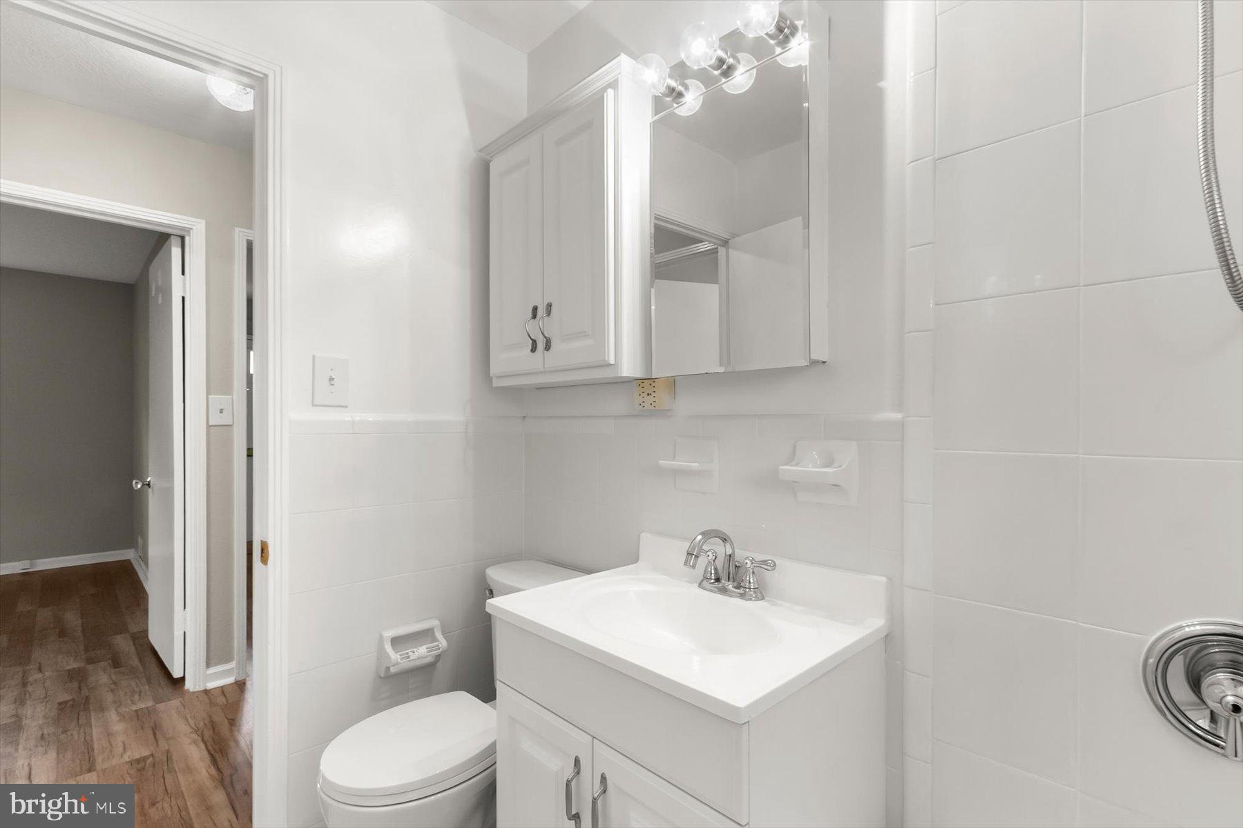3105 Fayette Road Kensington, MD 20895 - Photo 32 of 93 a bathroom with a toilet a sink and mirror