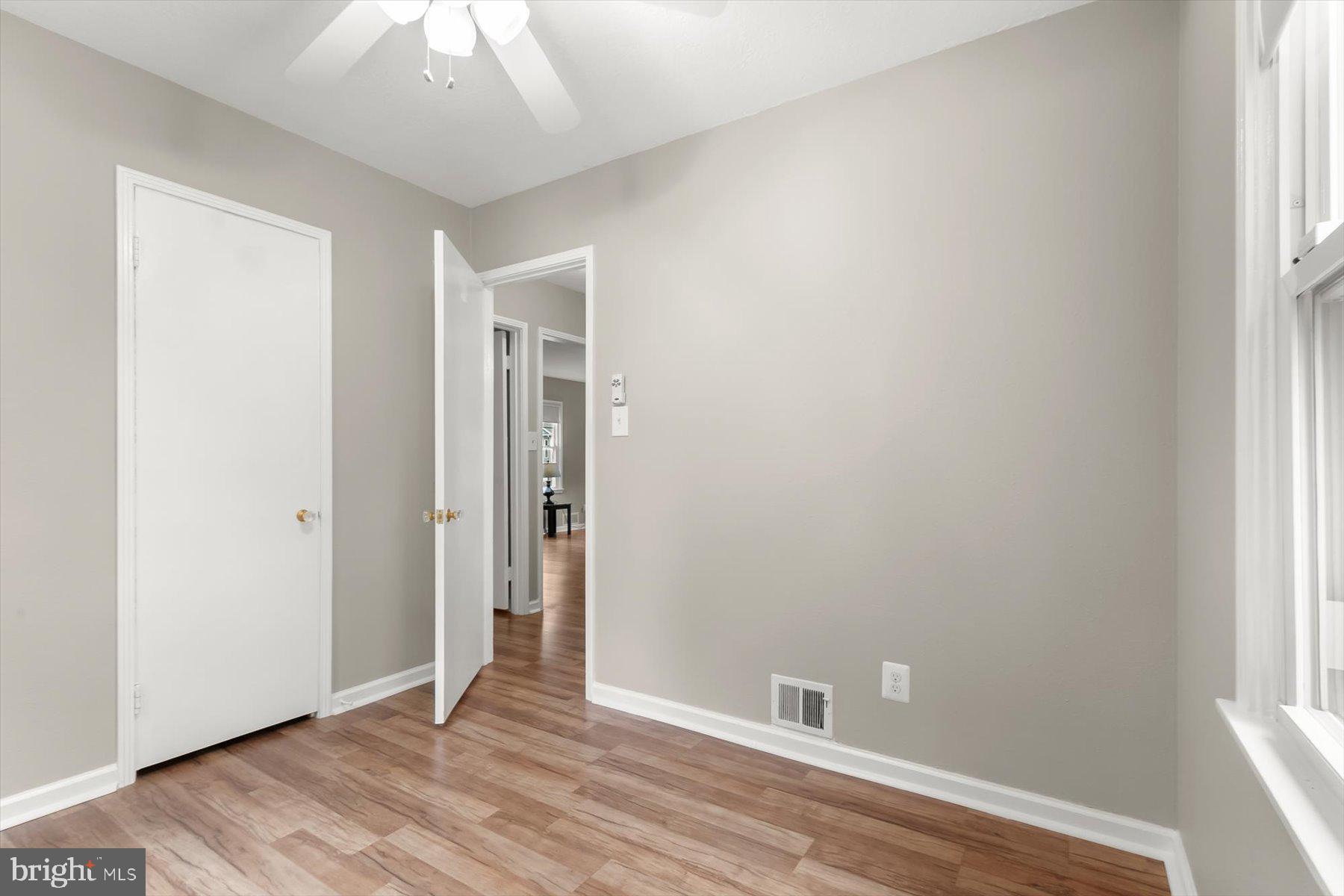 3105 Fayette Road Kensington, MD 20895 - Photo 35 of 93 an empty room with wooden floor and windows