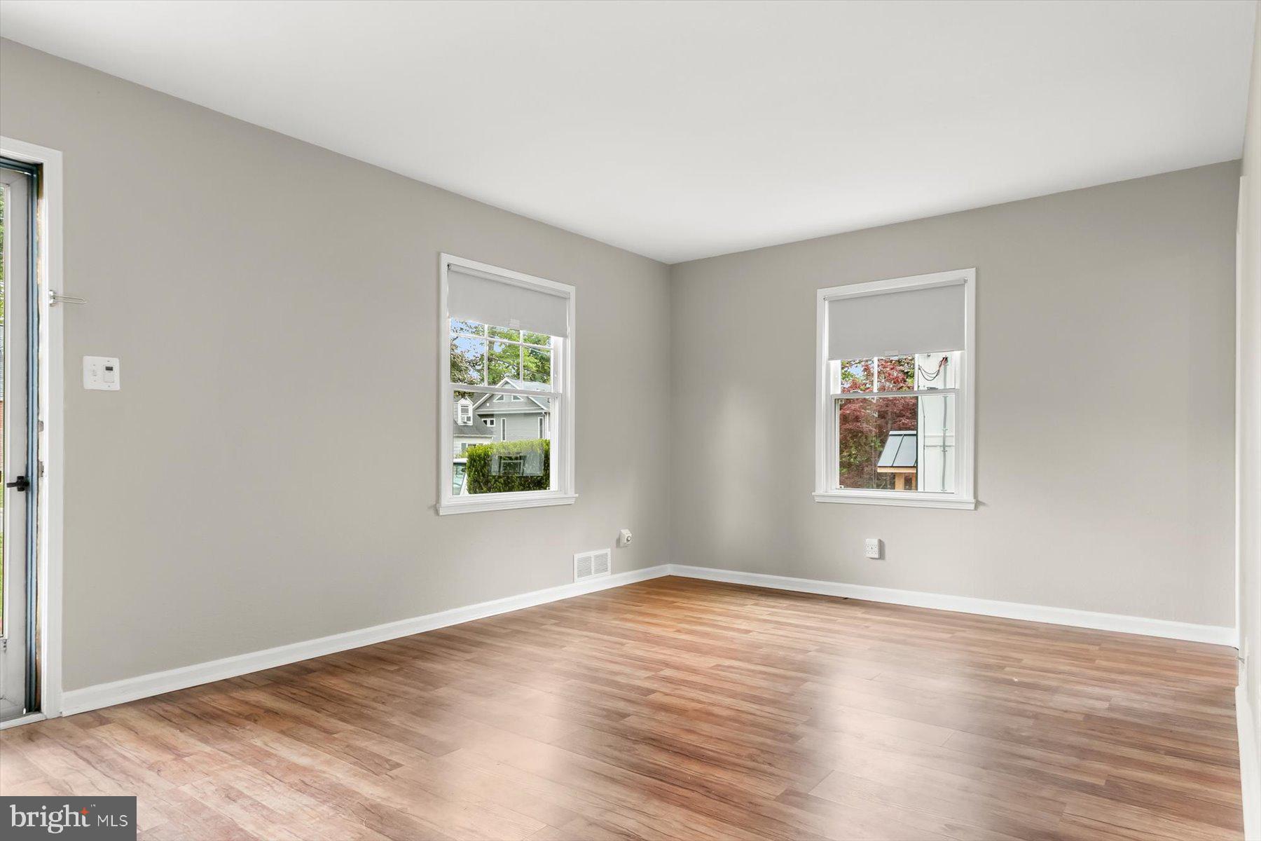 3105 Fayette Road Kensington, MD 20895 - Photo 5 of 93 a view of an empty room with wooden floor and a window