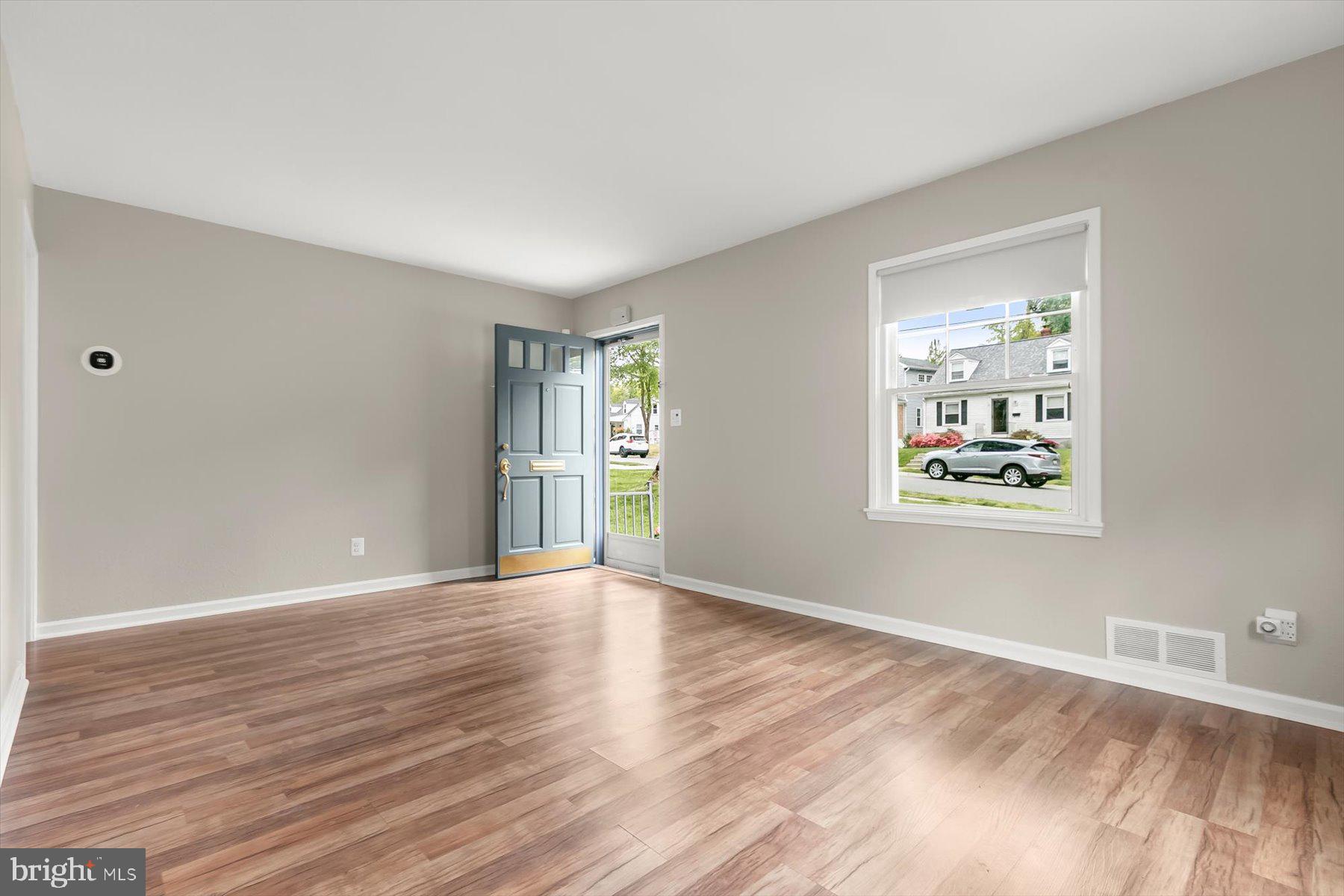 3105 Fayette Road Kensington, MD 20895 - Photo 6 of 93 a view of an empty room with wooden floor and a window