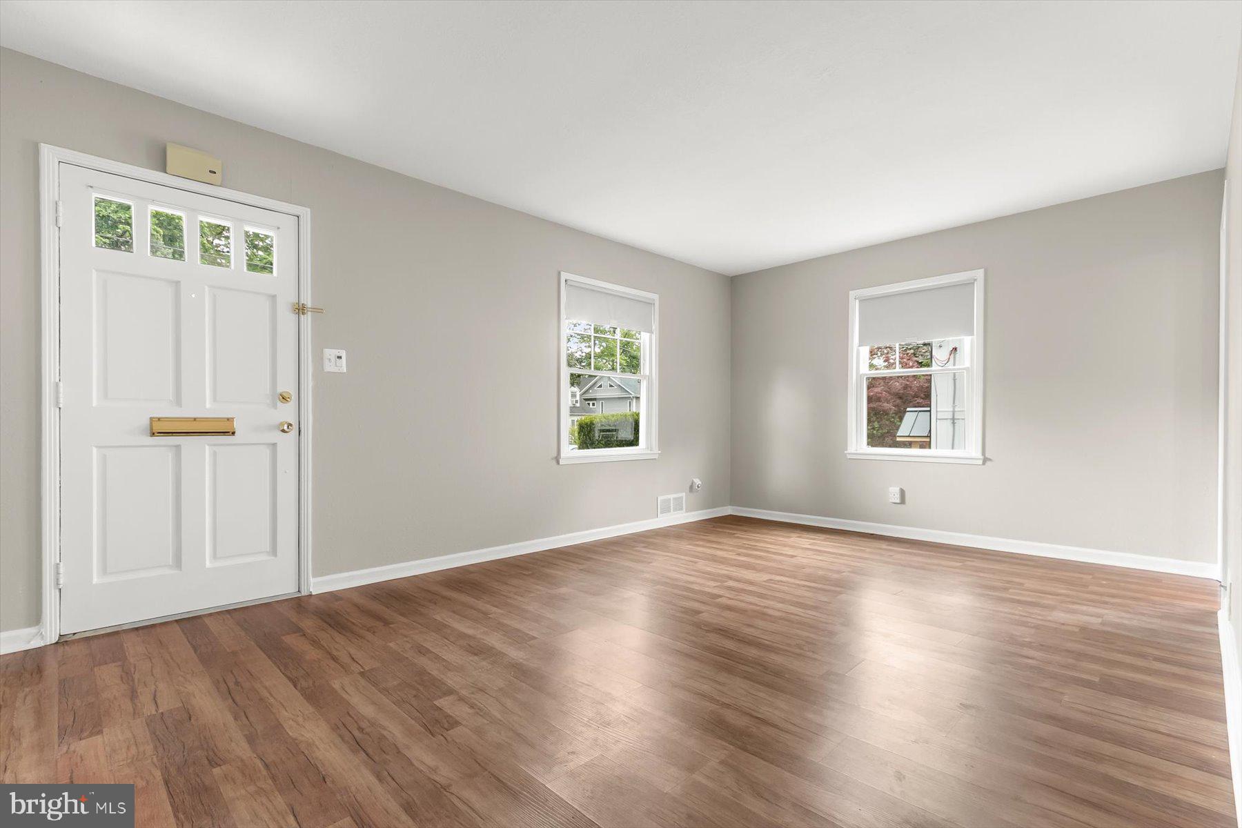 3105 Fayette Road Kensington, MD 20895 - Photo 10 of 93 an empty room with wooden floor and windows