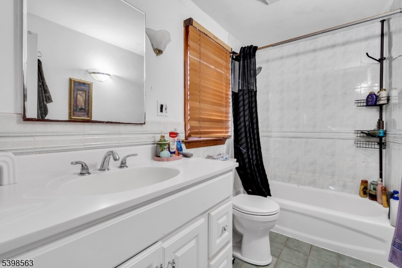 18 Belle Terre Road West Orange, NJ 07052 - Photo 11 of 23 a bathroom with a sink a toilet and a bathtub