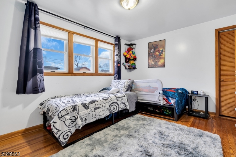 18 Belle Terre Road West Orange, NJ 07052 - Photo 13 of 23 a bedroom with bed and a large window