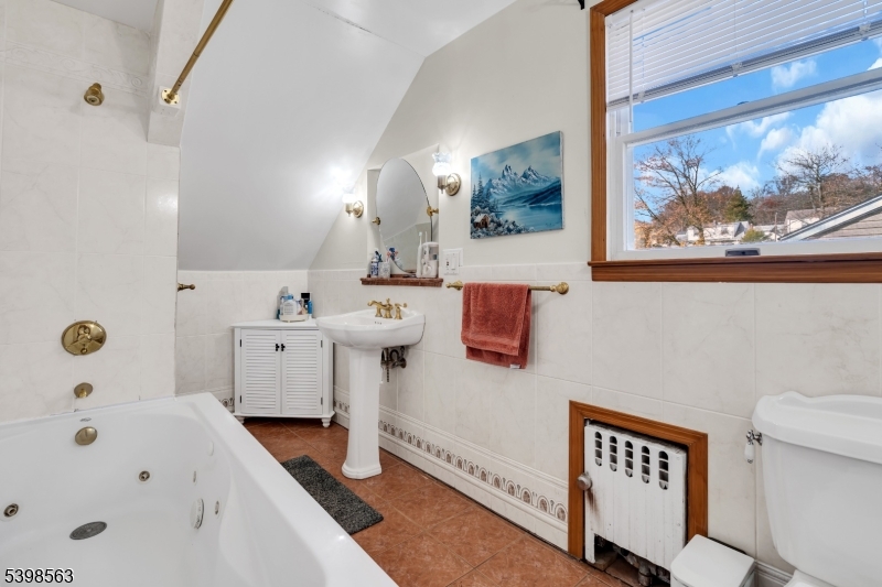 18 Belle Terre Road West Orange, NJ 07052 - Photo 14 of 23 a bathroom with a sink a toilet and a bathtub