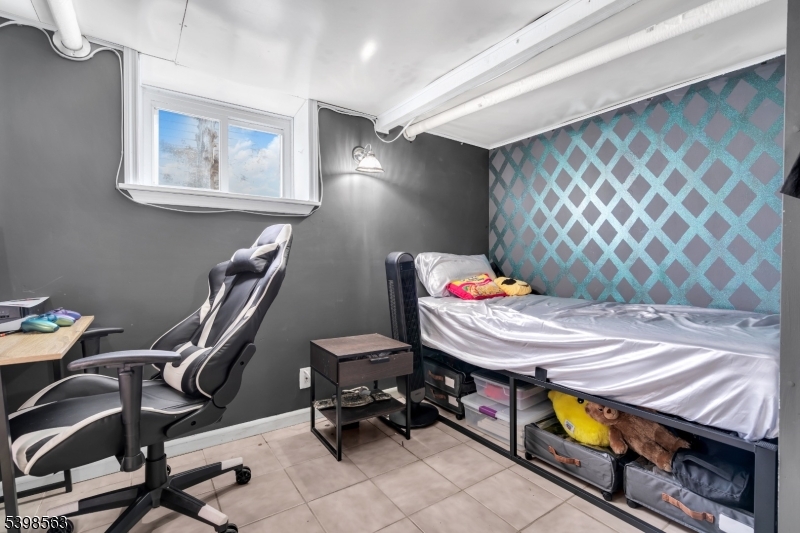 18 Belle Terre Road West Orange, NJ 07052 - Photo 15 of 23 a room with furniture and musical instruments