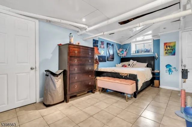 a bedroom with a bed and a cabinets