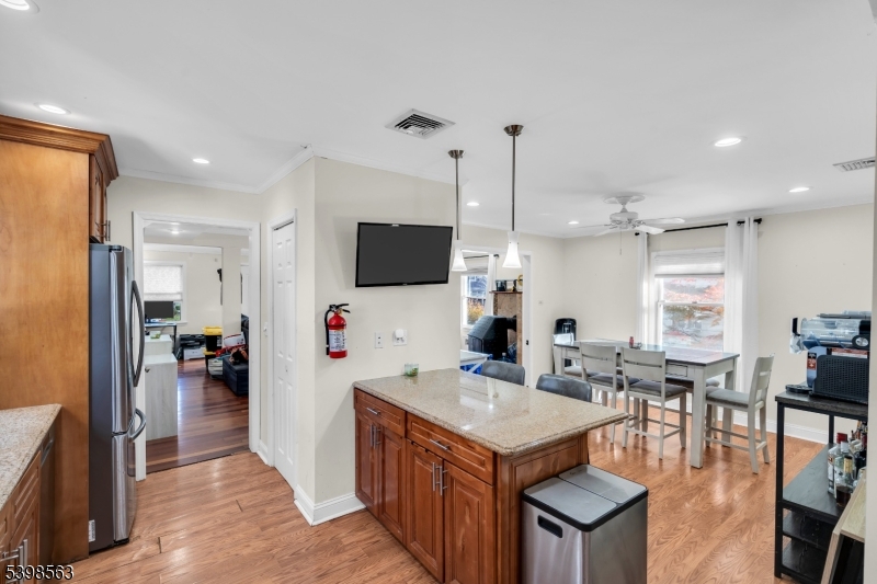 18 Belle Terre Road West Orange, NJ 07052 - Photo 4 of 23 a view of kitchen center island dining table and chairs