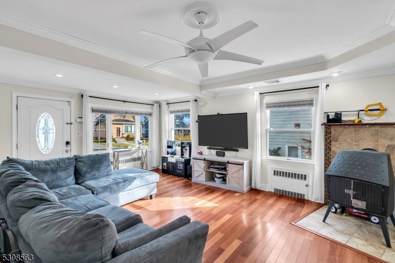 18 Belle Terre Road West Orange, NJ 07052 - Photo 8 of 23 a living room with furniture and a flat screen tv