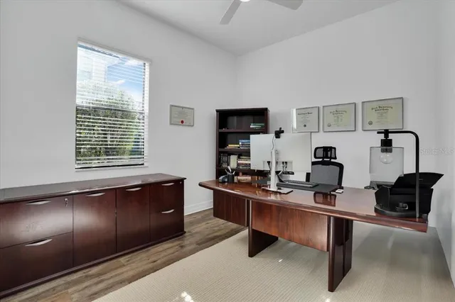 a view of an entryway with wooden floor