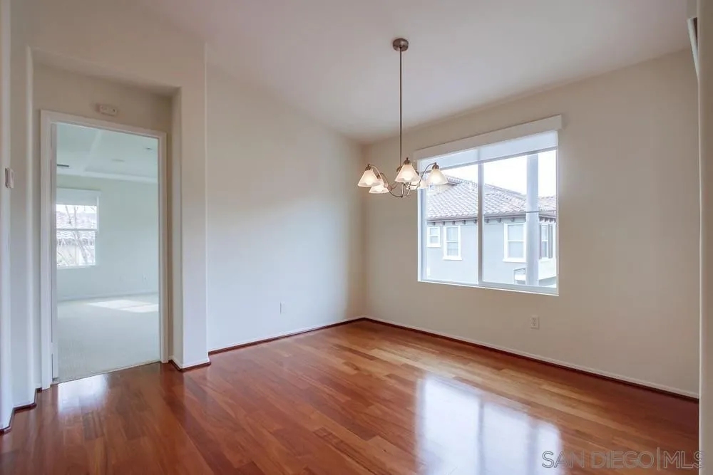1631 Avery Road San Marcos, CA 92078 - Photo 15 of 32 a view of an empty room with window and wooden floor