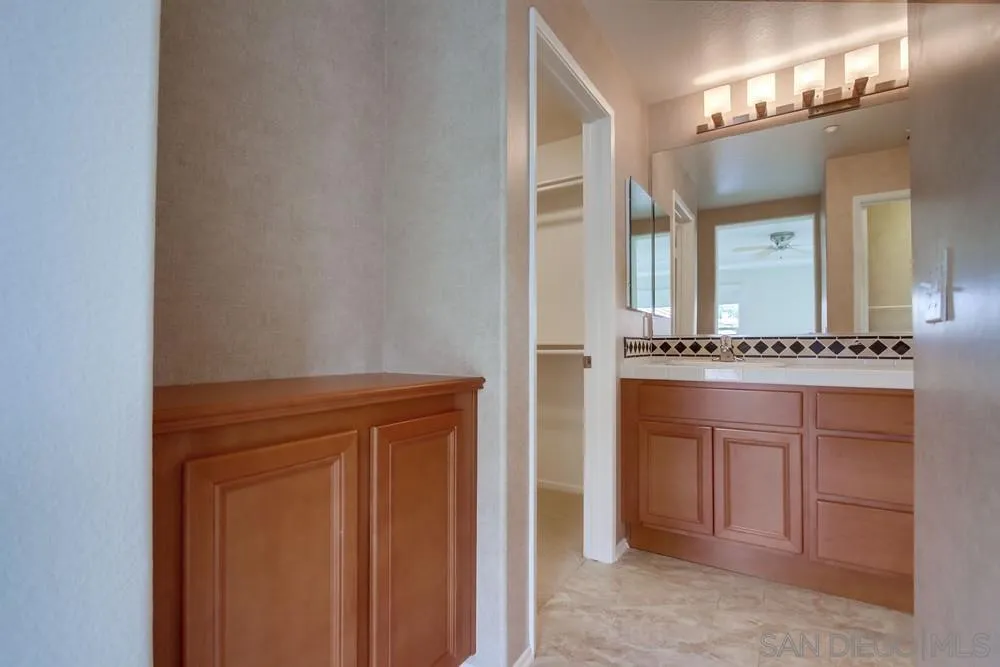 1631 Avery Road San Marcos, CA 92078 - Photo 21 of 32 a bathroom with a sink and a mirror