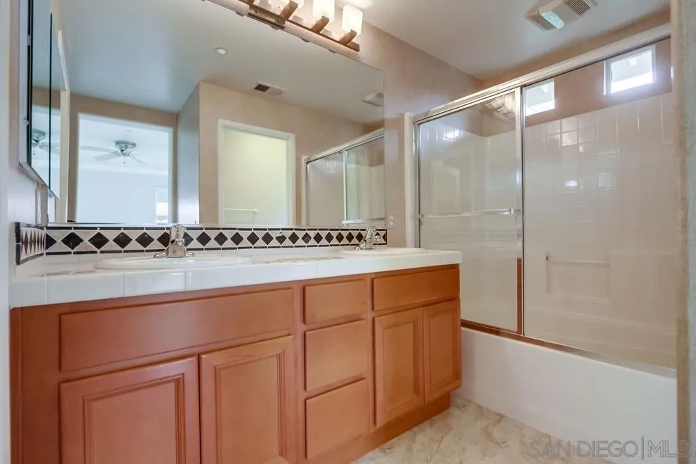 1631 Avery Road San Marcos, CA 92078 - Photo 22 of 32 a bathroom with a shower and a sink