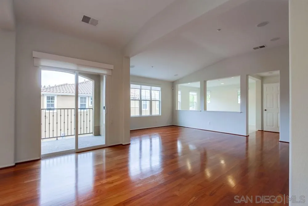 1631 Avery Road San Marcos, CA 92078 - Photo 5 of 32 a view of an empty room with wooden floor and a window