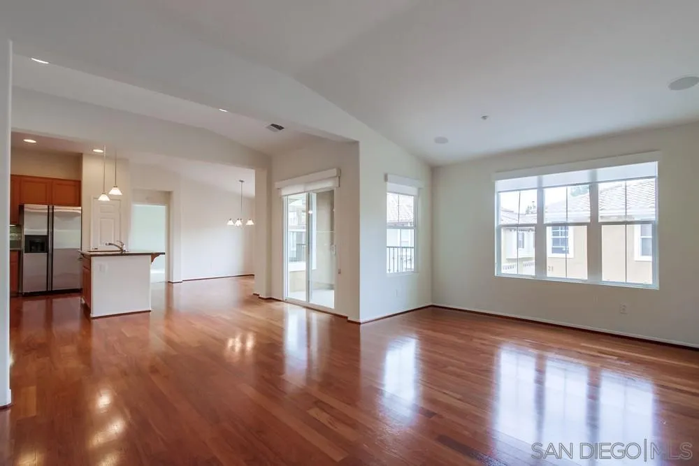1631 Avery Road San Marcos, CA 92078 - Photo 6 of 32 a view of an empty room with wooden floor and a window
