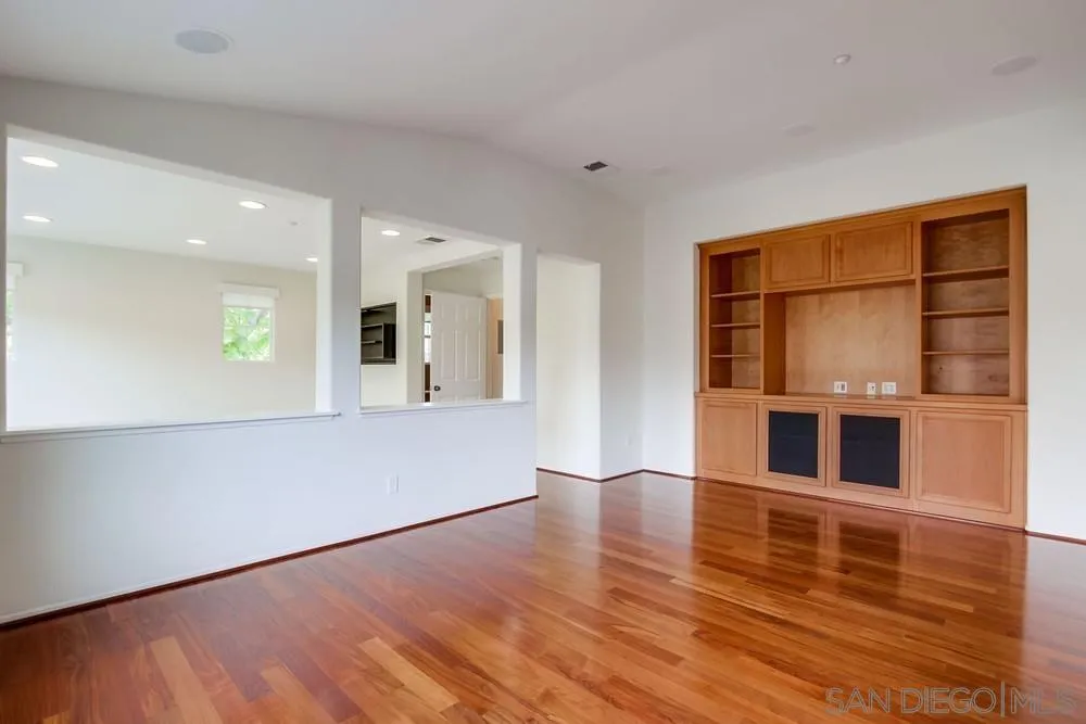 1631 Avery Road San Marcos, CA 92078 - Photo 8 of 32 a view of an empty room with wooden floor and a window