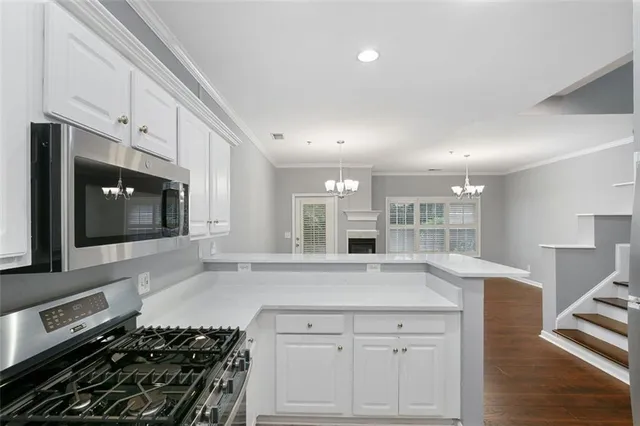 a large kitchen with a stove and a sink