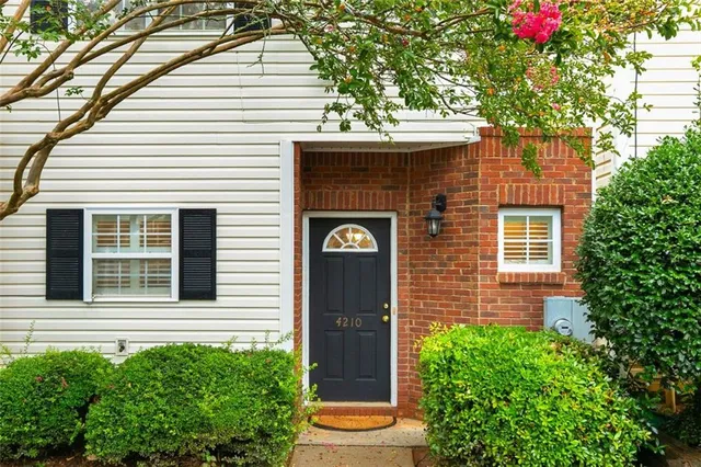 a front view of a house with a garage