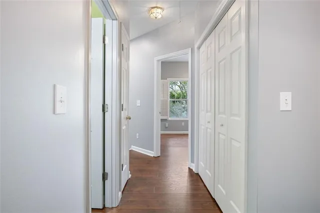 a view of a hallway with a wooden floor