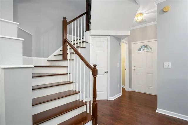 a view of entryway and hall with wooden floor