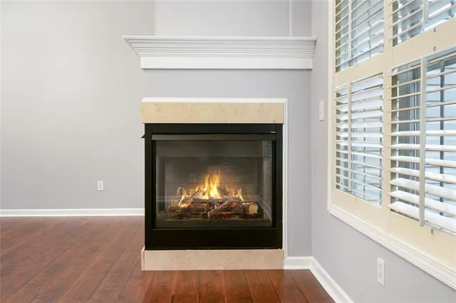 a view of a fireplace with wooden floor