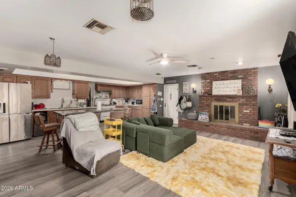 a living room with furniture and a fireplace